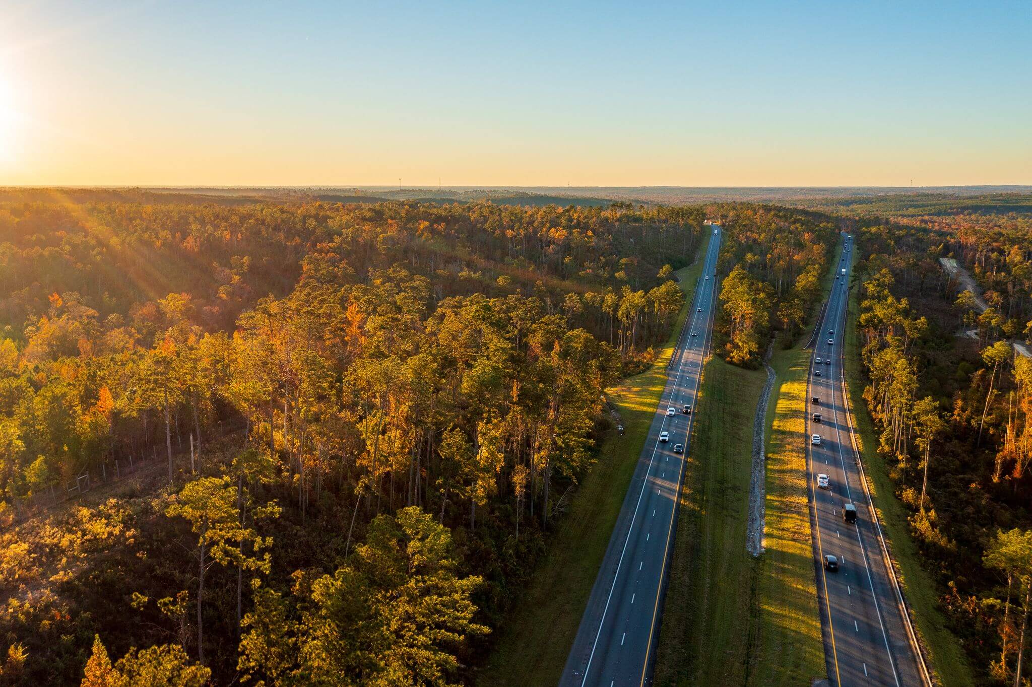 Aerial view of interstate at sunset.