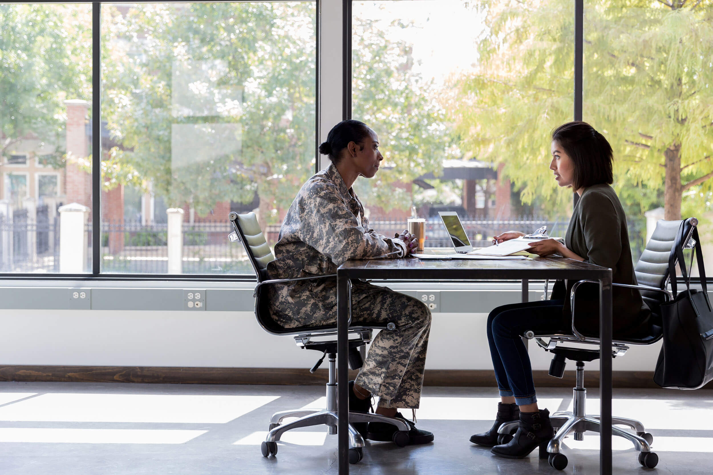 Female soldier meeting with a bank manager